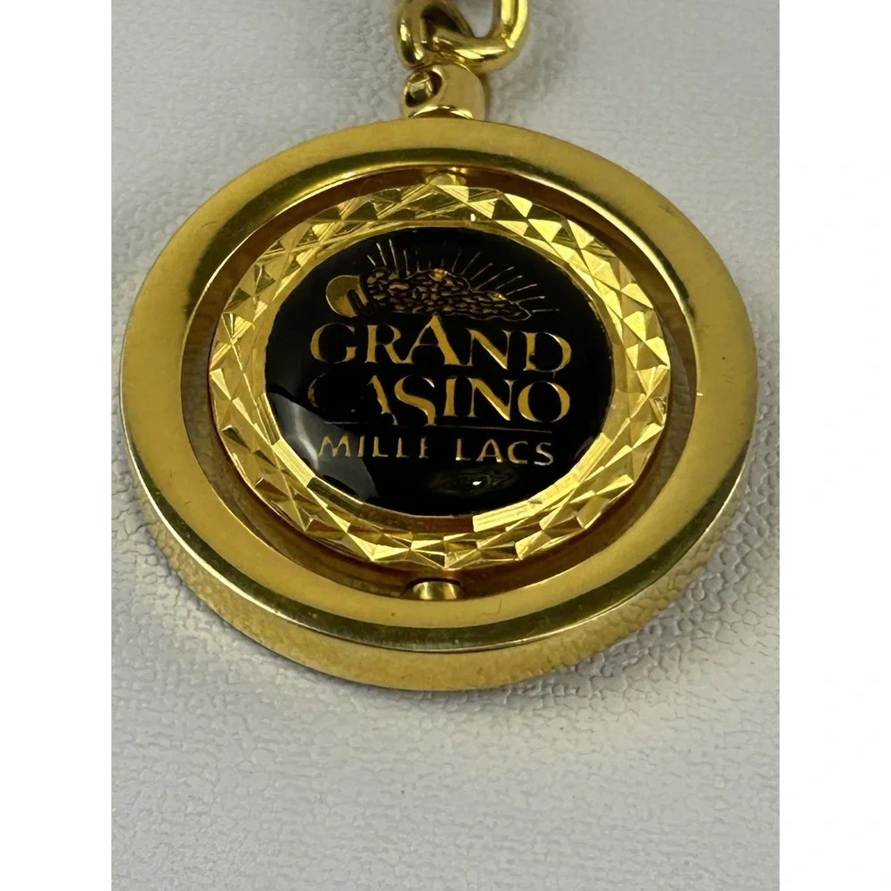 Vintage Grand Casino Mille Lacs Gold Tone Spinner Keychain Fob Souvenir